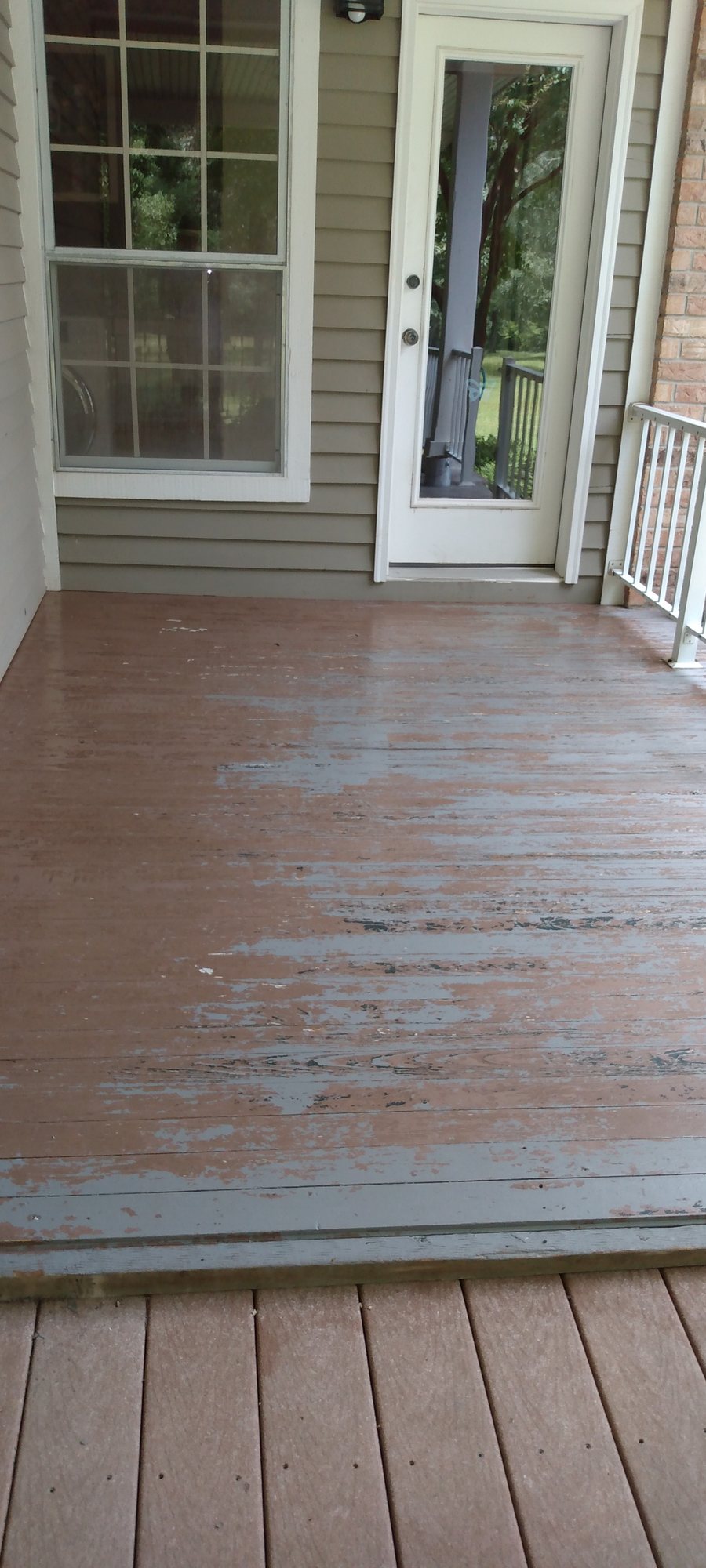 The same decking before refinishing, worn and peeling
