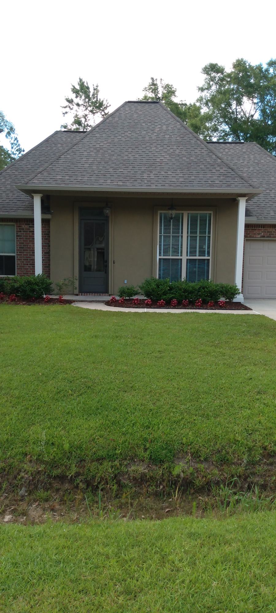 The same home before painting, in its original beige